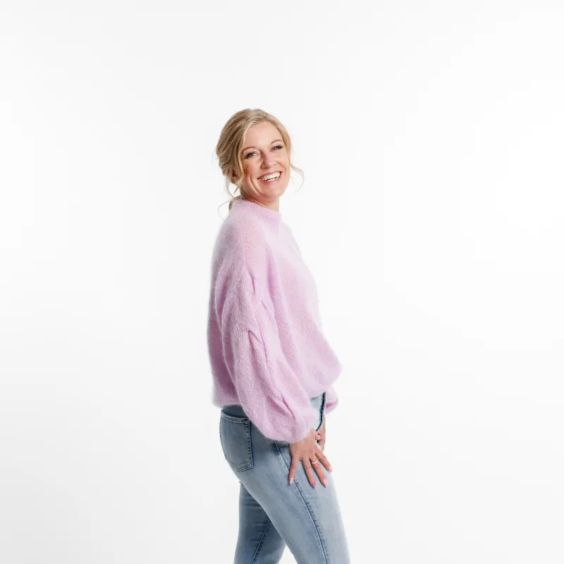 Side view of the plait sleeve knitting pattern. There is a soft braid on top of the sleeve