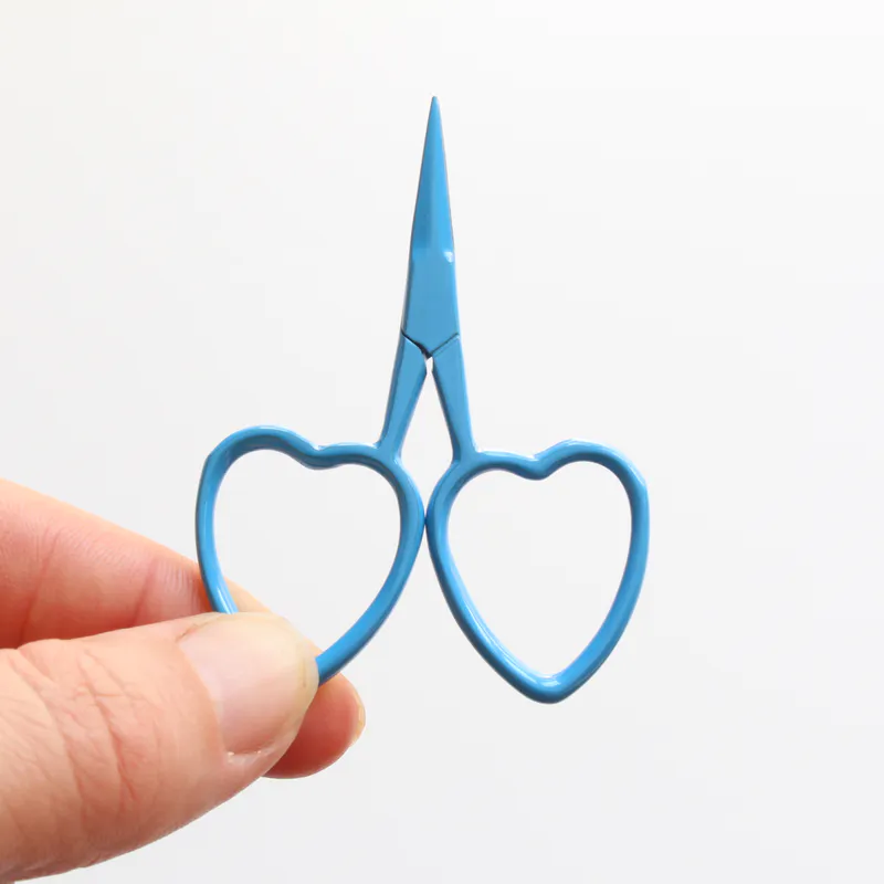Blue scissors with heart shaped handles
