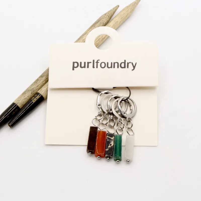 Stone inspired stitch markers in dark tones