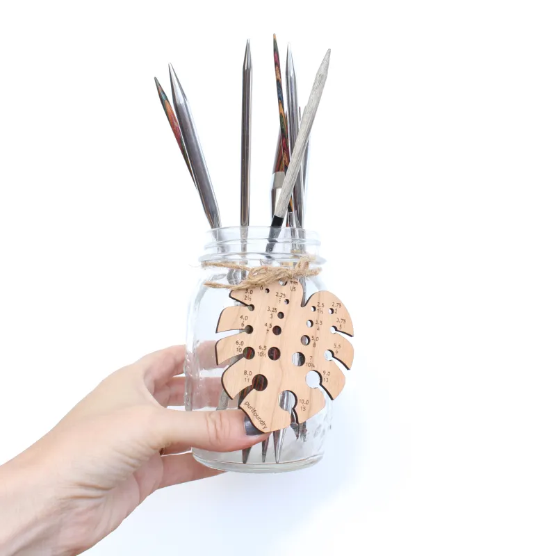 Interchangeable knitting needle tips stored in a jar