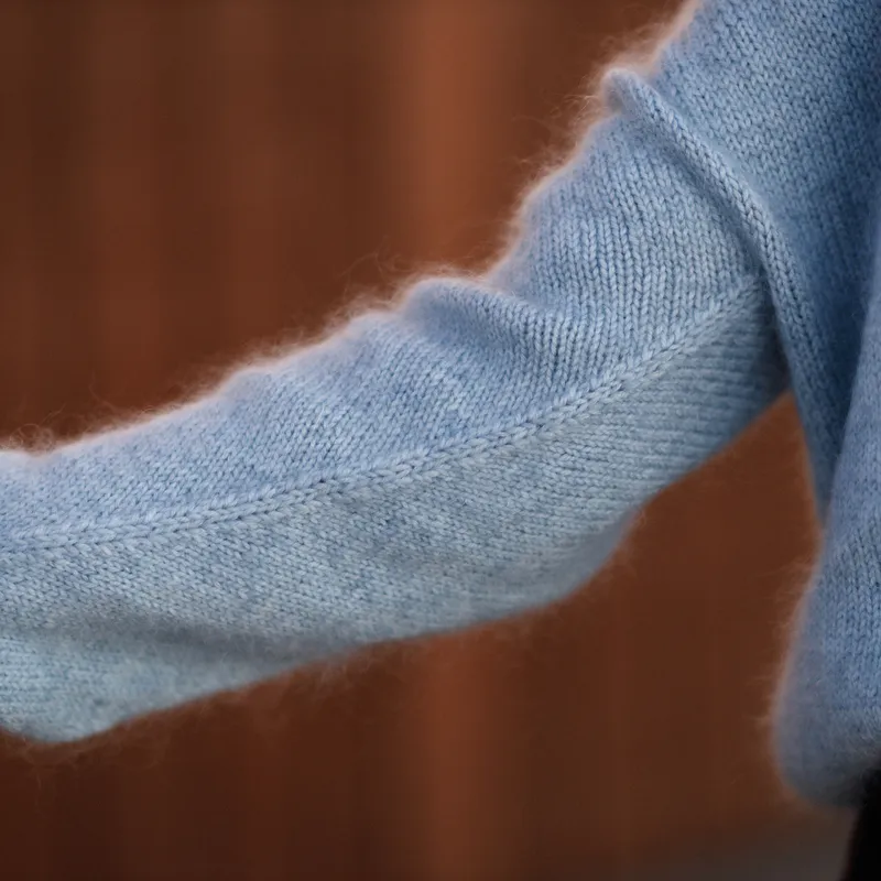 A view of the under sleeve of the Ridgeline Cardi. It features decrease stitches down the length of the sleeve to ensure perfect drape and fit.
