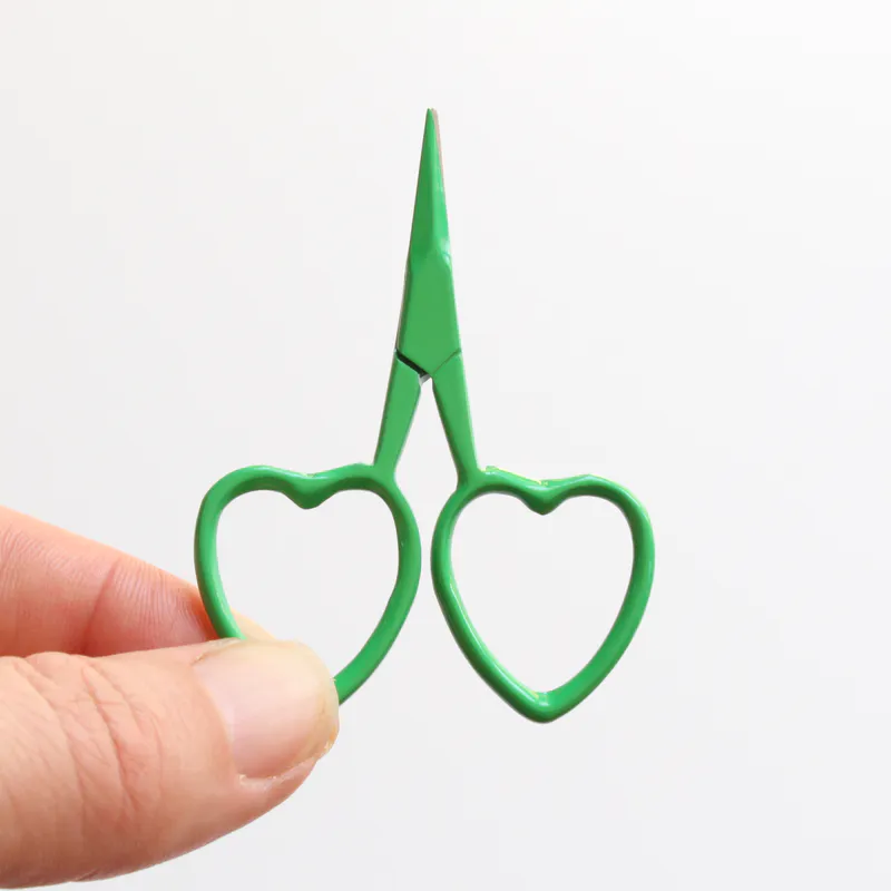 Green scissors with heart shaped handles
