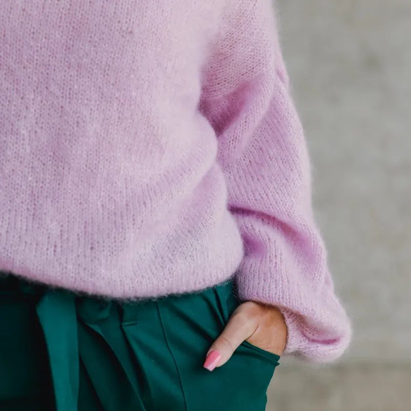 A close up of the cuff and sleeve on a Plait Sleeve Sweater.