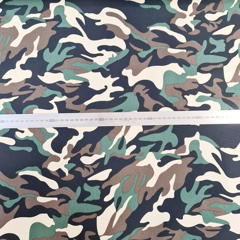 green and brown camo pattern on canvas fabric
