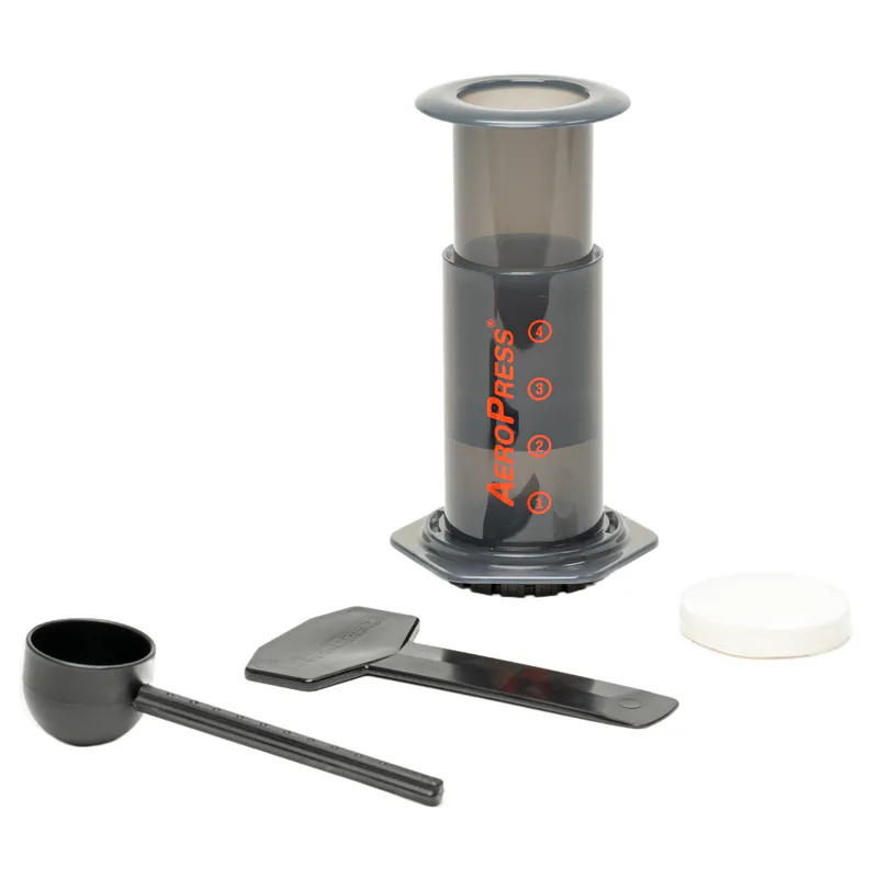 AeroPress coffee maker, scoop, stirrer and paper filters