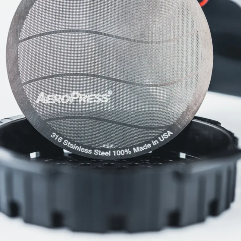 The AeroPress Stainless Steel reusable filter fits into the AeroPress filter cap for use