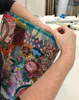 Stitching a fabric work by Fleur Woods