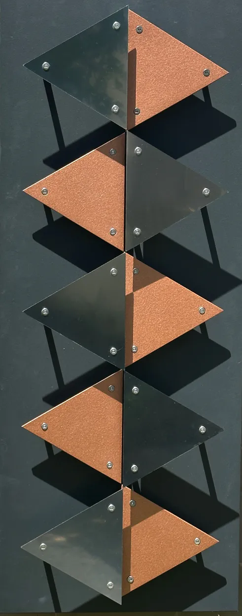 A 3D wall sculpture of a waterfall made with stainless steel by Ashley Crabb available at The Little Gallery in Tairua