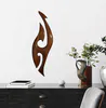 A handcrafted wooden hook wall hanging by sculptor Ron Stark at The Little Gallery in Tairua
