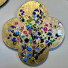 An original Acrylic painting of flowers with a gold leaf background on a quatrefoil wooden base by Kristin Hyde, available at The Little Gallery Tairua