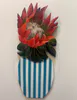 An original Acrylic painting of a Protea in a vase cut into the shape of a flower in a vase by Lesley Campbell, available at The Little Gallery Tairua