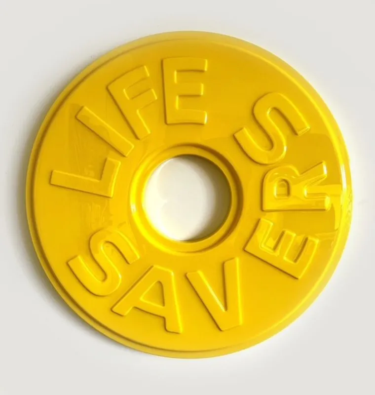 An original over-sized sculpture of a yellow Life Saver candy by Clint C, available at The Little Gallery Whangamata