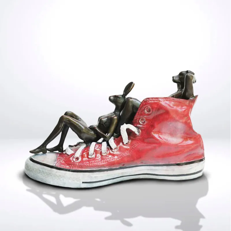 Solid bronze scupture of Dogman Rabbitwoman side on by Gillie and Marc at The Little Gallery Whangamata