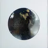 A small original circular abstract painting by Tairua artist Michael Harrison, available at The Little Gallery Whangamata