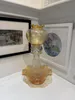 A beautifully curated recycled glass candelabra with Orange Frills by Sassy Maz, available at The Little Gallery Tairua