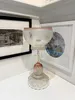 A creatively curated recycled glass candelabra with pink accents by Sassy Maz, available at The Little Gallery Tairua
