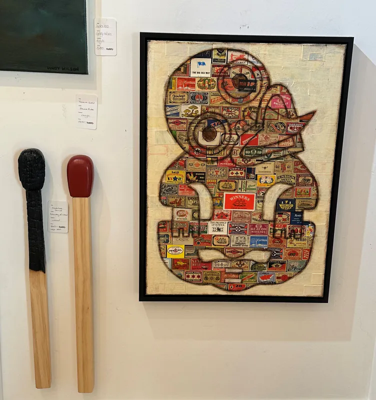 A tiki artwork created out of matchboxes with match sculptures, by Lyndy Wilson