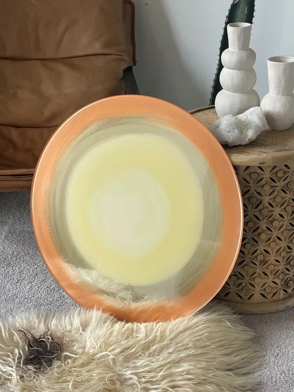 An original circular painting by New Zealand artist Hollie O'Neill, available at The Little Gallery Whangamata