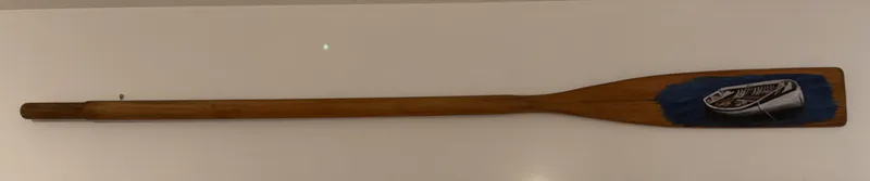 An old Oar with a beautifully painted boat scene by Jennifer Panther, available at The Little Gallery Whangamata