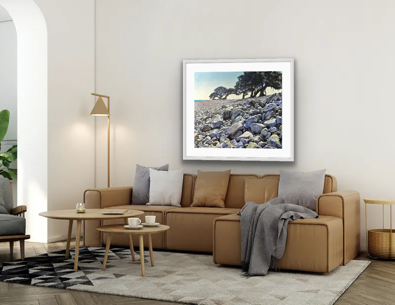 A virtually staged fine art print of a rocky Coromandel beach by the late New Zealand artist Grant Simpson, available at The Little Gallery Tairua