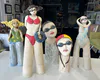 Cheeky ceramic sculptures of swimming ladies by Nikky Seales available at The Little Gallery in Whangamata