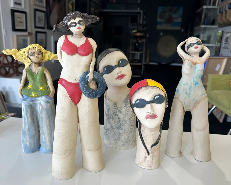 Cheeky ceramic sculptures of swimming ladies by Nikky Seales available at The Little Gallery in Whangamata