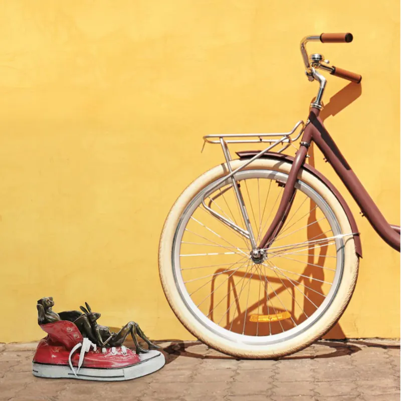 Solid bronze scupture with Dogman beside bike by Gillie and Marc at The Little Gallery Whangamata