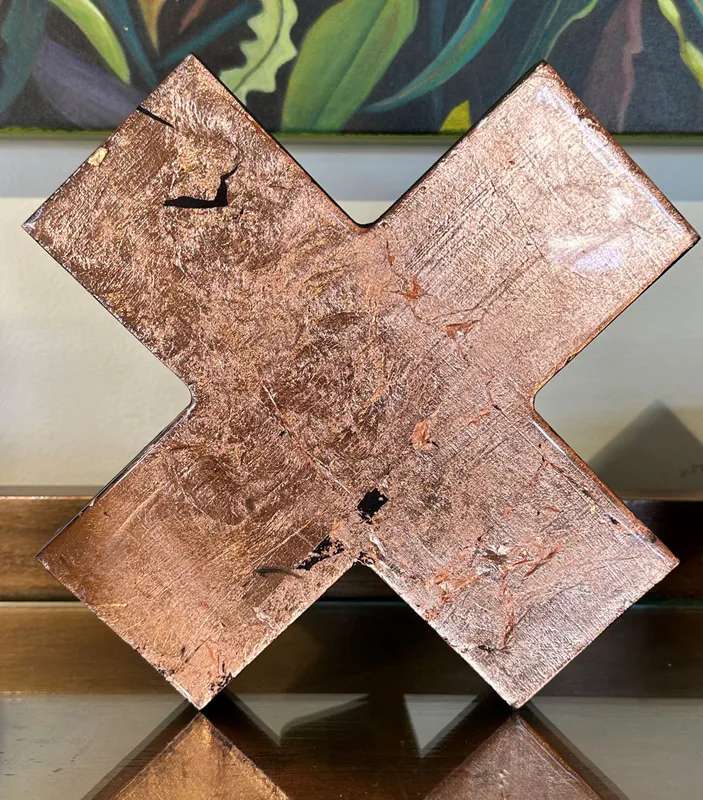 An original wall art with Copper leaf on a Kiss-shaped board by Kristin Hyde, available at The Little Gallery Whangamata