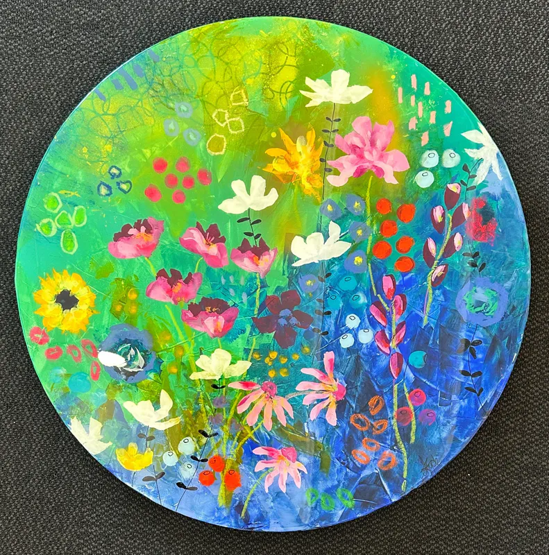 An original circular painting of flowers with a resin coating by Kristin Hyde, available at The Little Gallery Tairua