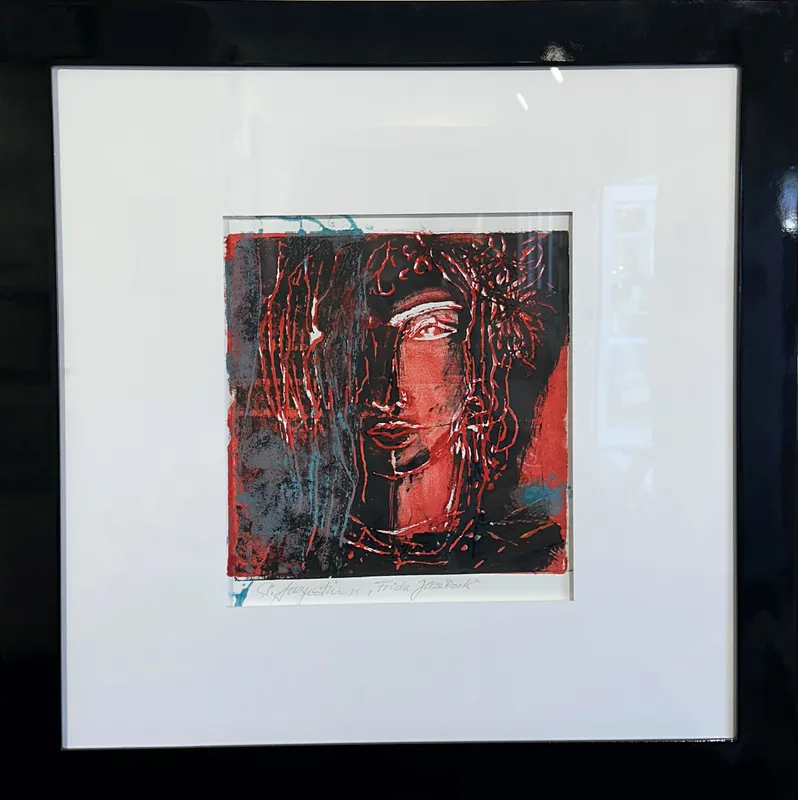 A painting of Freda Kahlo with a large white matt and black frame by Whitianga based Artist Peter Augustin, available at The Little Gallery Whangamata