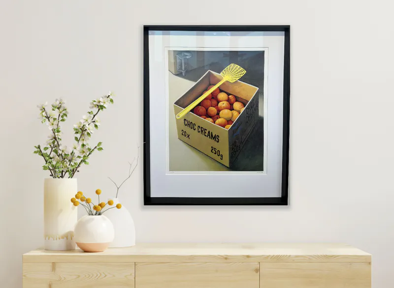 The yellow fly swat staged with box of fruit by Artist Michael Smither available at The Little Gallery Whangamata