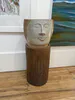 A handmade clay head planter on stand by Ian Webster, available at The Little Gallery Tairua