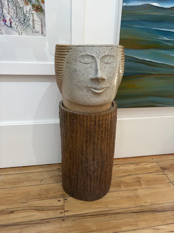 A handmade clay head planter on stand by Ian Webster, available at The Little Gallery Tairua