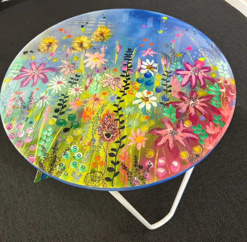 An original colourful acrylic painted, resin-coated side table by Kristin Hyde, available at The Little Gallery Whangamata