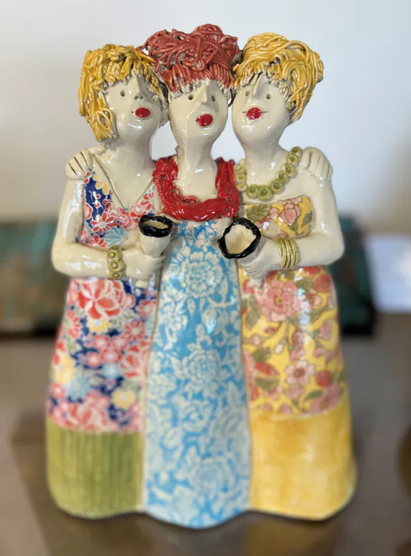 A joyful Ceramic sculpture of 3 woman friends together by Mandy Olson, available at The Little Gallery Whangamata