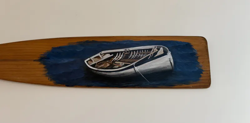 An original Acrylic artwork of a moored boat painted on an Oar by Jennifer Panther, available at The Little Gallery Tairua