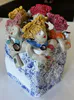 A Ceramic sculpture of a group of women with wine glasses and bottles of bubbly by Mandy Olson, available at The Little Gallery Whangamata