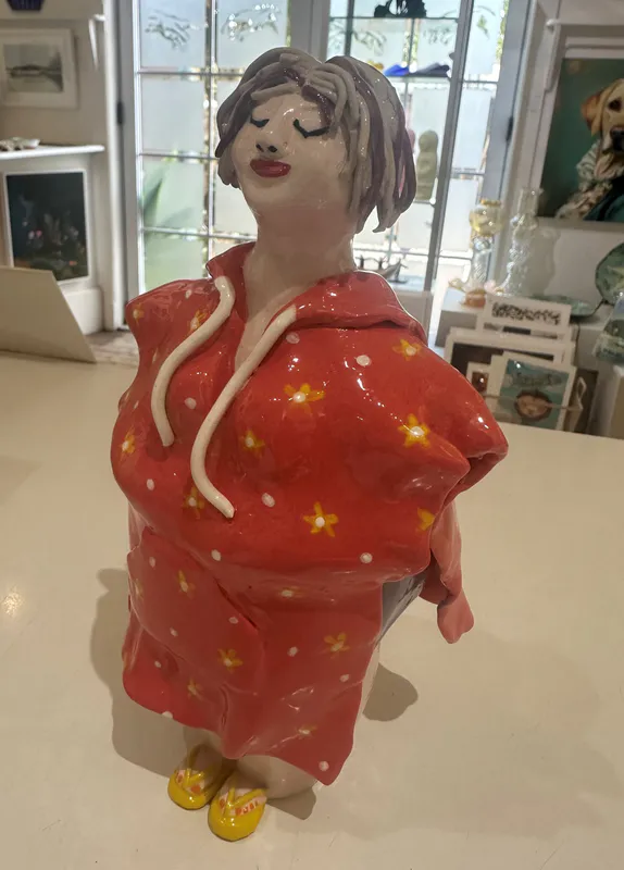 An original ceramic figure of a lady wearing a swim towel by LeeBee, available at The Little Gallery Whangamatā