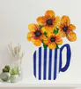 A hand cut wall hanging in the shape of a jug with yellow flowers by Artist Lesley Campbell available at The Little Gallery in Whangamata