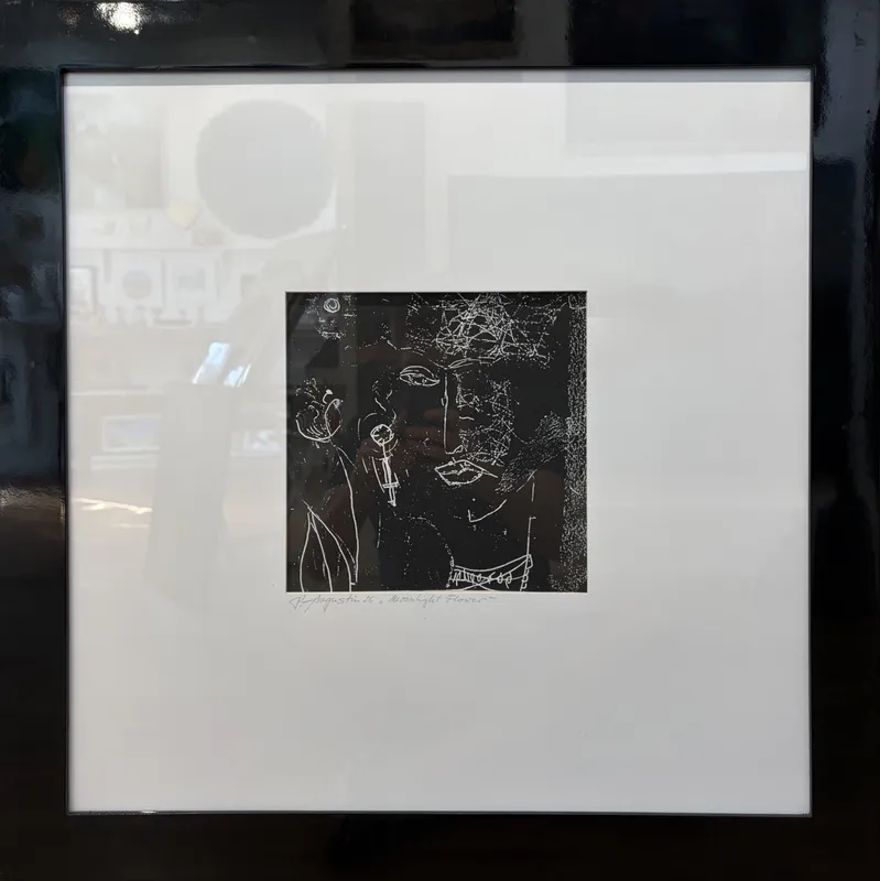 An original monochromatic Monoprint with large white mat and slick black frame by Peter Augustin, available at The Little Gallery Tairua