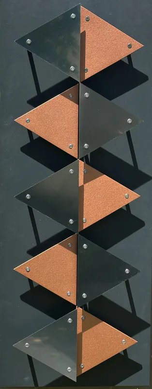 A 3D wall sculpture made from stainless steel and kevlar called Waterfall by Ashley Crabb available at The Little Gallery in Tairua