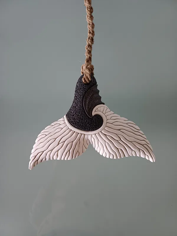 A Ceramic wall hanging Whale Tail by New Zealand artist Jo Richards Hooker, available in The Little Gallery Tairua