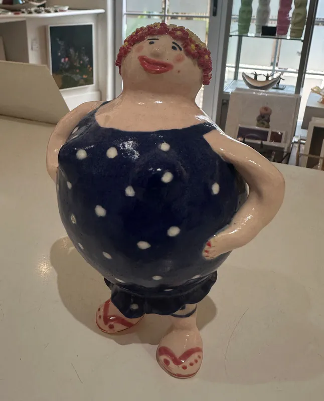 An original quirky ceramic figure of a lady in a polka dot dress by LeeBee, available at The Little Gallery Whangamatā