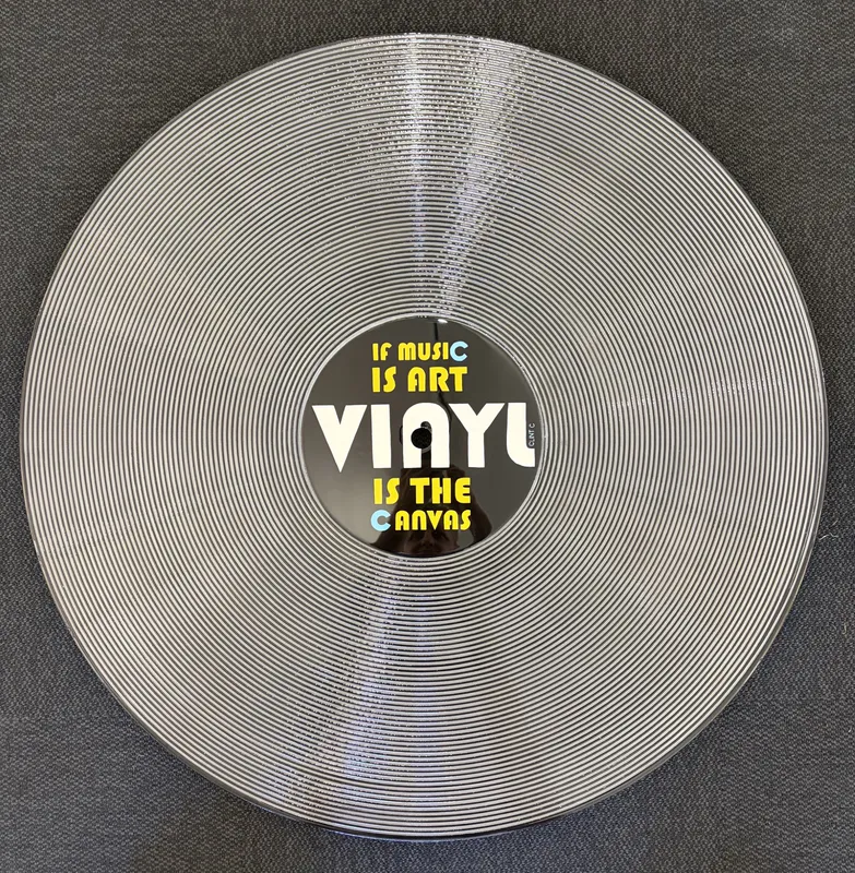 A large resin-coated artwork of a Vinyl record by Clint C, available at The Little Gallery Whangamata