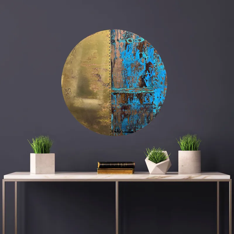 A Copper and Bronze round wall sculpture like Blood Moon by Jasmine Keir available at The Little Gallery in Tairua
