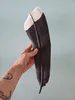 A ceramic Huia Feather sculpture by New Zealand artist Jo Richards Hooker, available at The Little Gallery Tairua