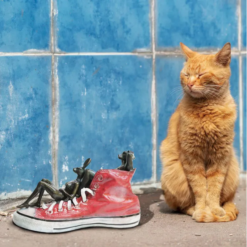 Solid bronze scupture of Dogman Rabbitwoman with cat by Gillie and Marc at The Little Gallery Whangamata