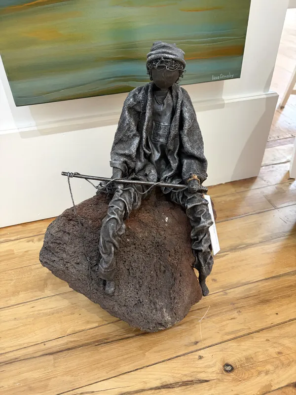Fabric and Paverpol Fisherman sculpture by Shona MacDonald, available at The Little Gallery Tairua