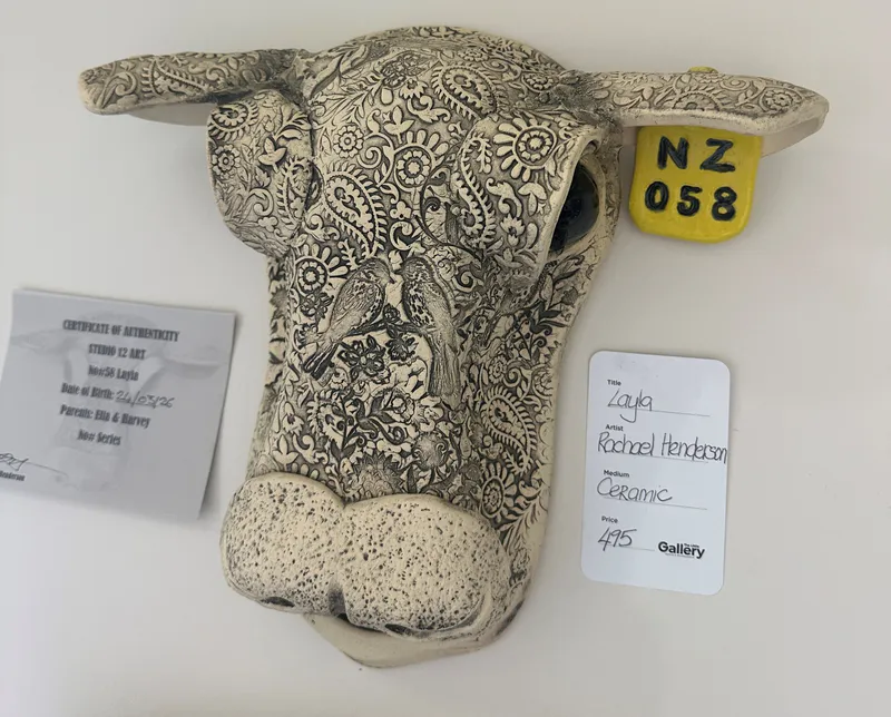 A ceramic Cows Head with tattooed details and a ear tag No 58 by Rachele Henderson, available at The Little Gallery Tairua