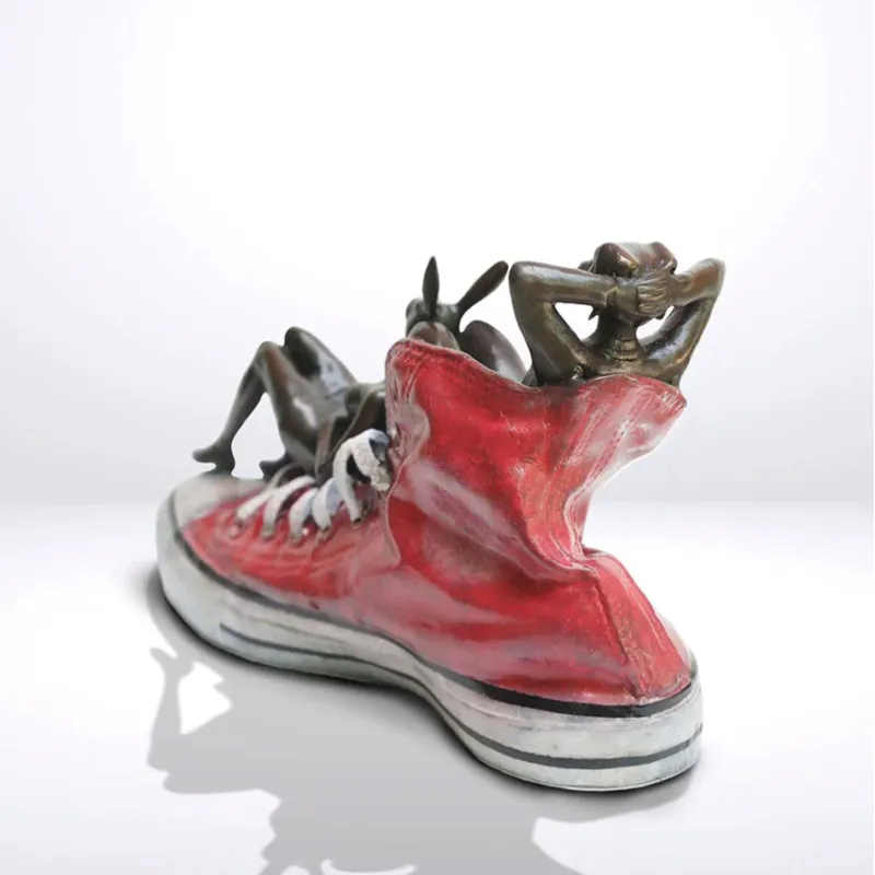 Solid bronze scupture of Dogman Rabbitwoman from behind by Gillie and Marc at The Little Gallery Whangamata